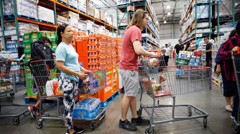 People with carts waiting in line at Costco