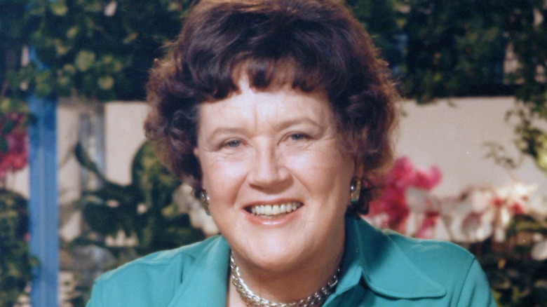 Chef Julia Child smiling in her kitchen