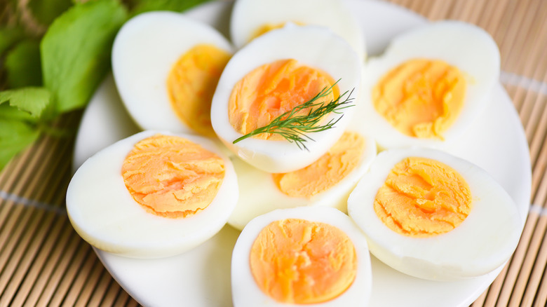 Hard boiled eggs sliced on plate