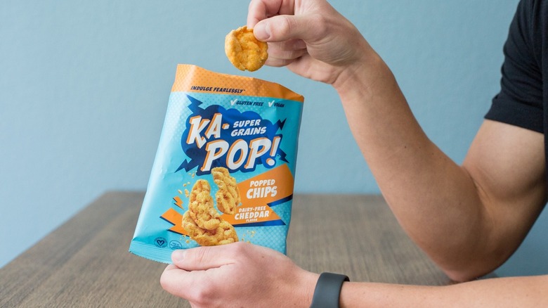 Person holding a bag of K-Pop!'s snack
