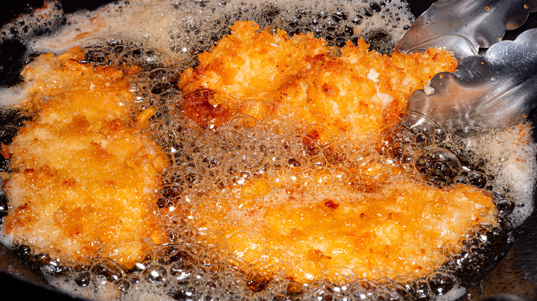 chicken frying in oil