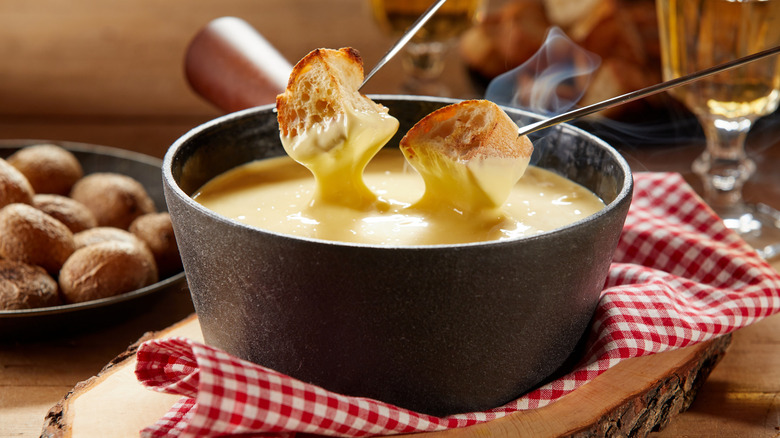 Creamy cheese fondue with toasted bread to dip
