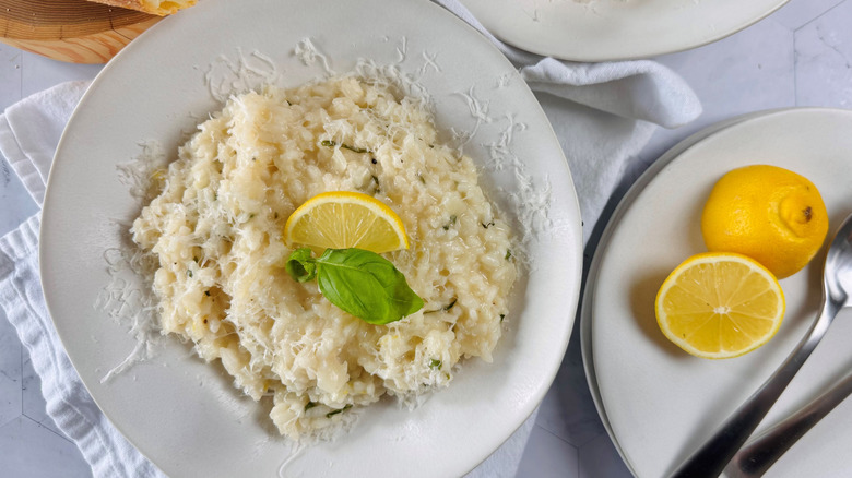 lemon basil risotto in bowl with garnishes