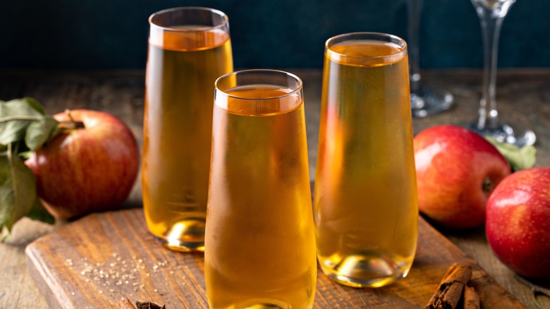 apple cider mimosas and apple on a serving platter