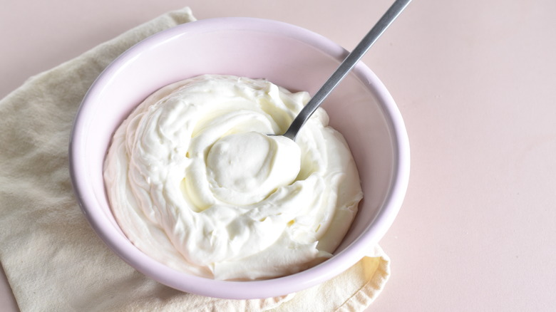 whipped cream in pink bowl