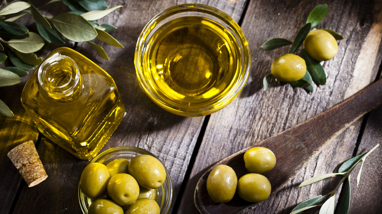 A bottle and a bowl of olive oil