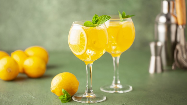 Glasses of limoncello spritz plus lemons