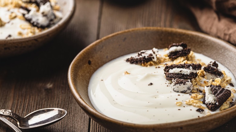 yogurt in bowls topped with crumbled cookies