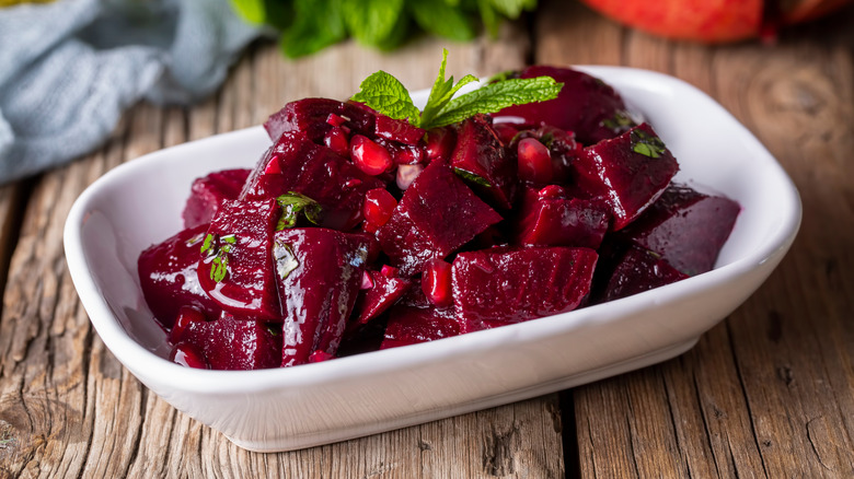 Marinated Greek style beets in white bowl