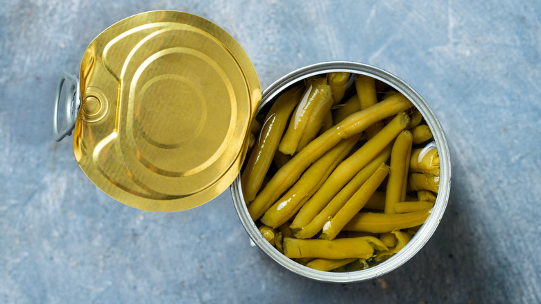 An opened can of green beans