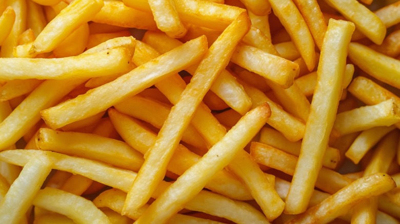 Cooked french fries crowded together