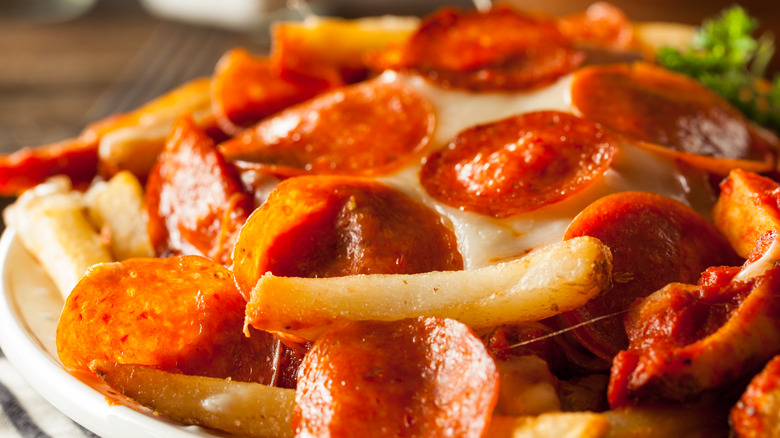 French fries topped with cheese and pepperoni