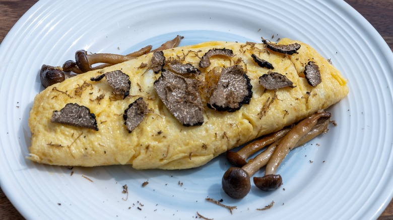 French omelet with mushrooms and truffle shavings