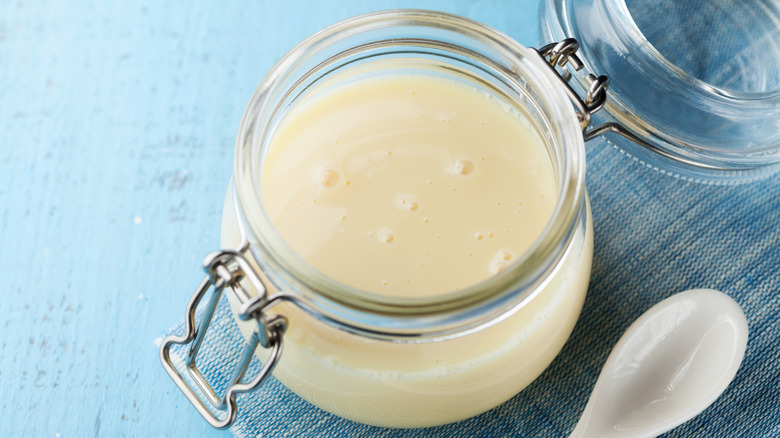 Sweetened condensed milk in glass container