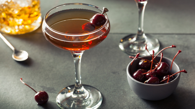 Glass of Manhattan cocktail with cherries