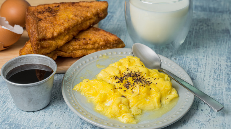 Scrambled eggs with side of maple syrup