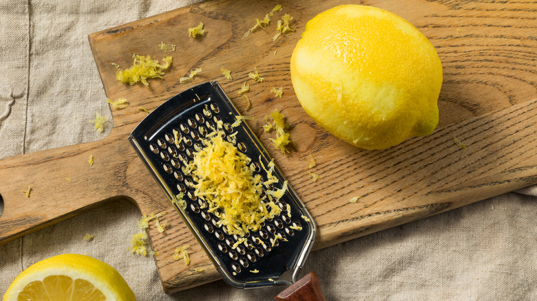 Lemon with grater and zest