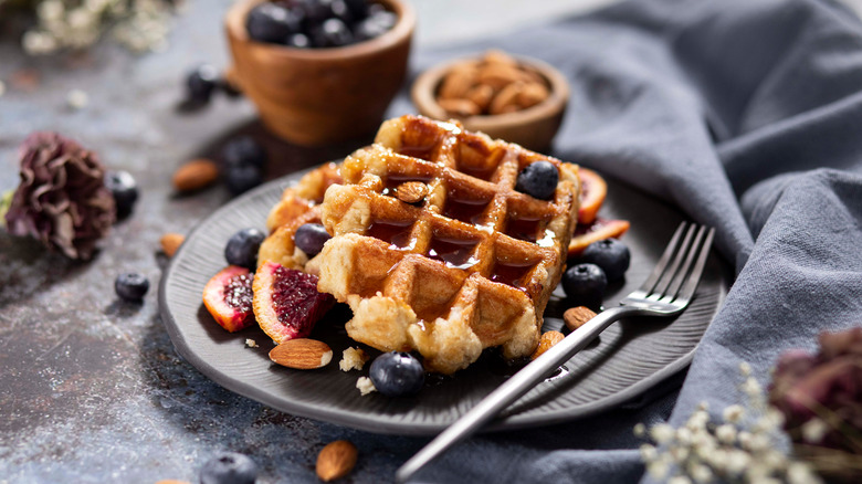 homemade belgian waffles with toppings on plate