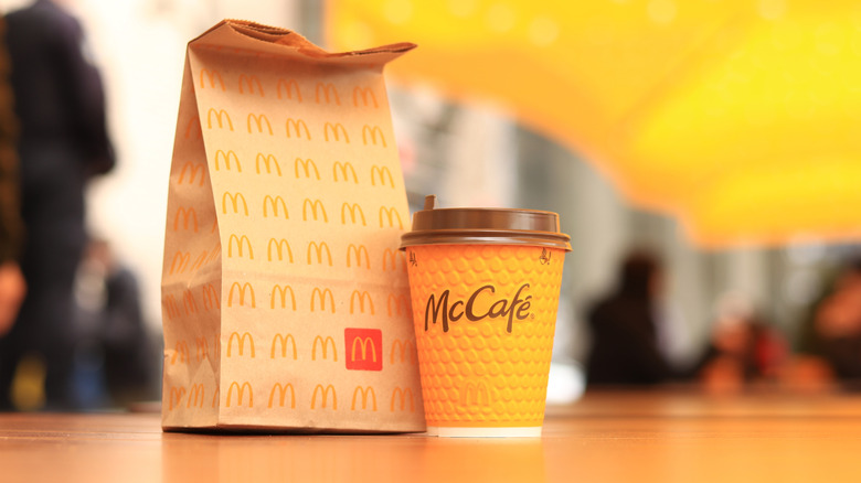 McDonald's bag and McCafe coffee on a table