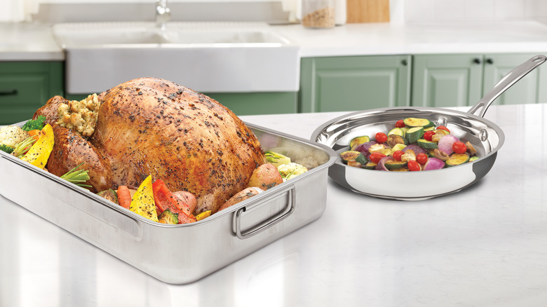 cooked whole turkey and vegetables on counter