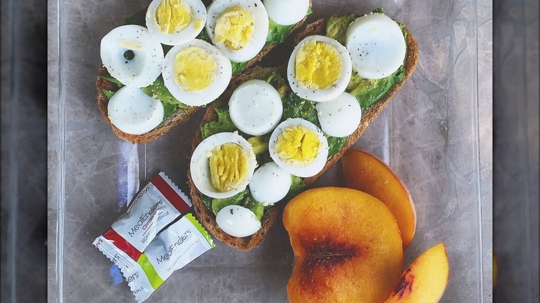 MealEnders lozenges with egg avocado toast and stone fruit