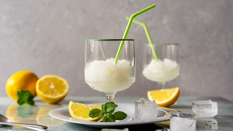 lemon sorbet in glass with lemon slices and mint