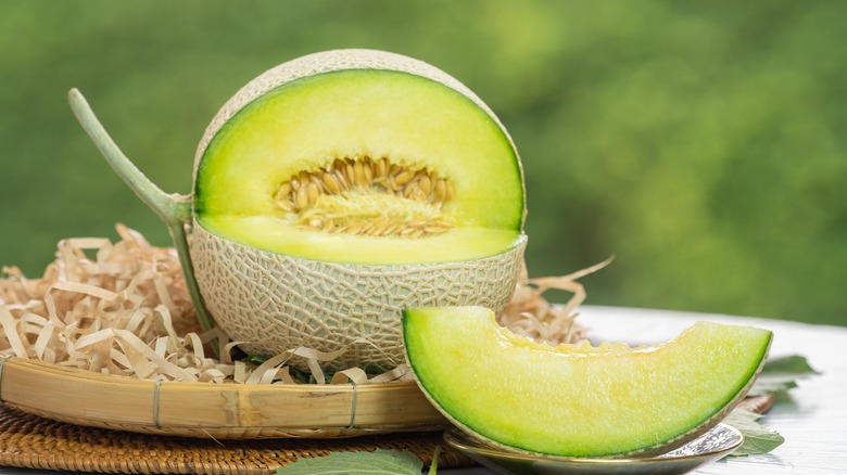 Sliced crown melon on table