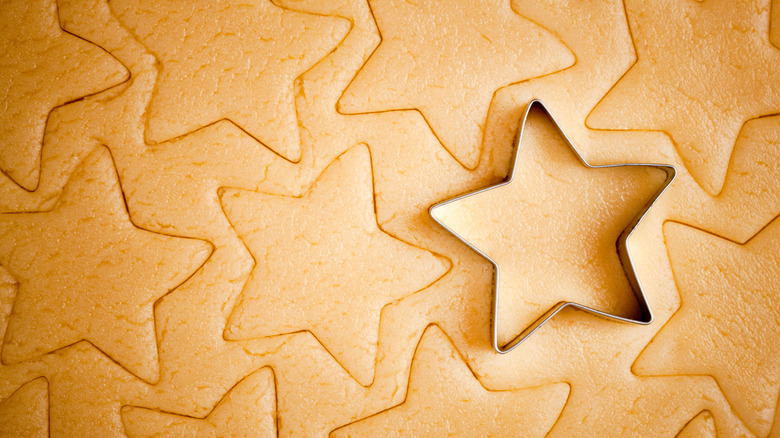 Star cookie cutter pressed to dough