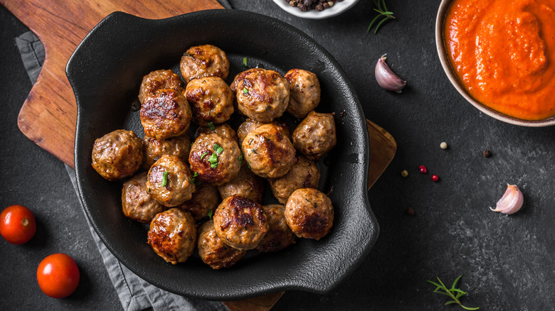 A skillet full of meatballs ready to eat