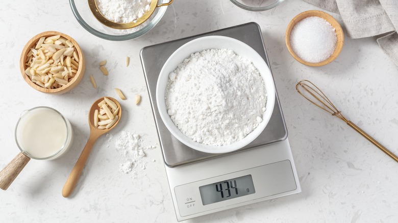 weighing flour on digital scale