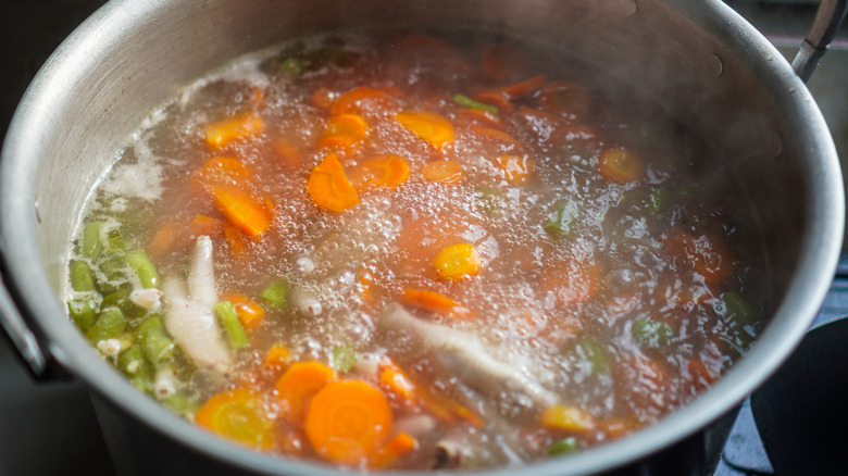 Soup ingredients simmering in pot