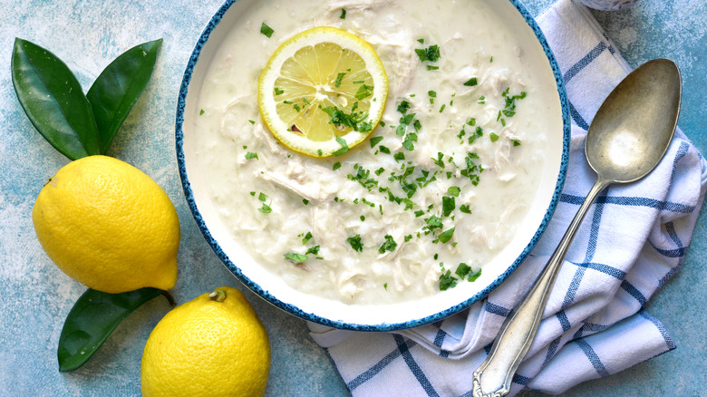 Chicken soup with slice of lemon on top