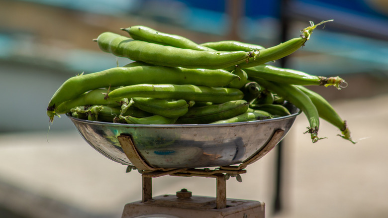 green beans on a weighing scale