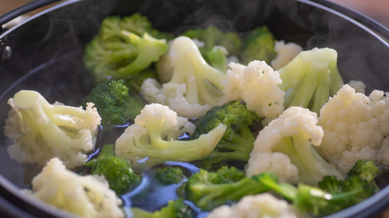 broccoli and cauliflower in a soup pot