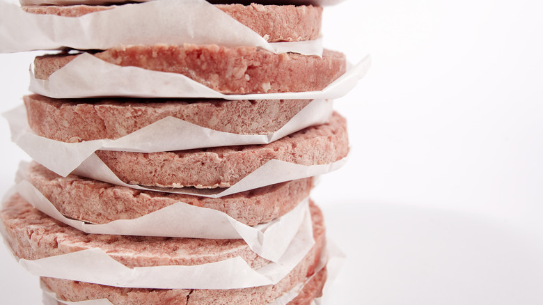 Stack of frozen burger patties