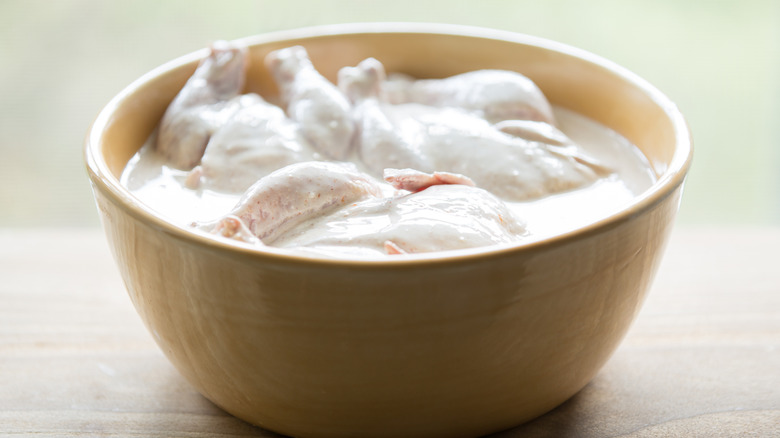 chicken wings marinating in buttermilk