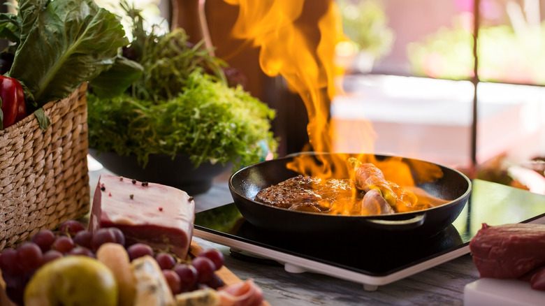 steak flambeing in pan