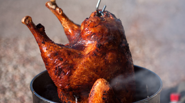 Deep-fried turkey pulled from vat of hot oil