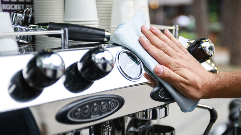 Hand wiping coffee machine with cloth