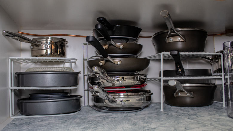 stored pans in kitchen