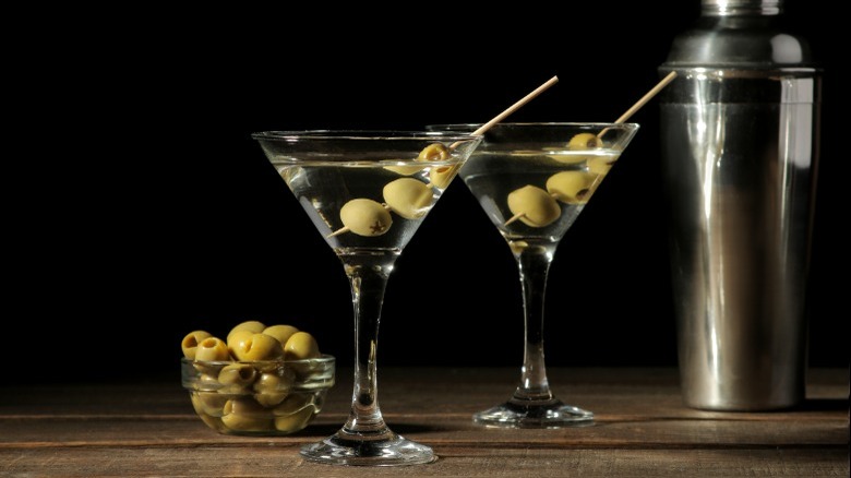 Two martinis with olives 