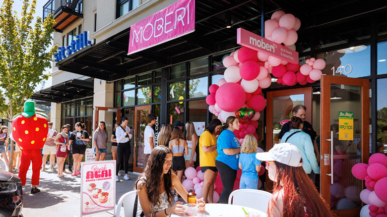 Moberi store grand opening with people in line