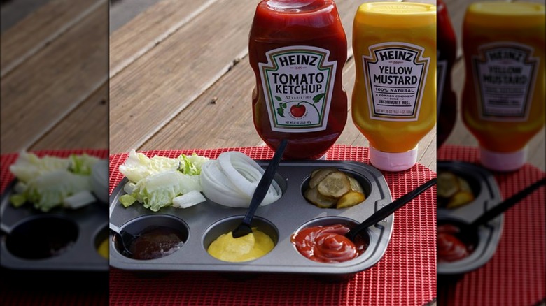Heinz condiments and vegetables in a muffin tin