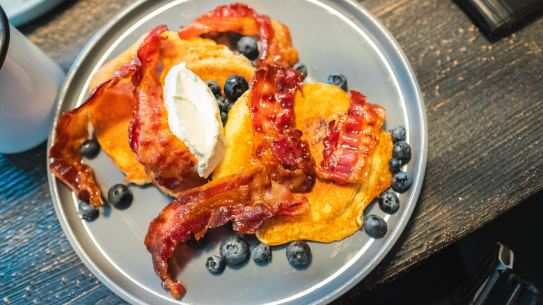 Pancakes with blueberries and bacon