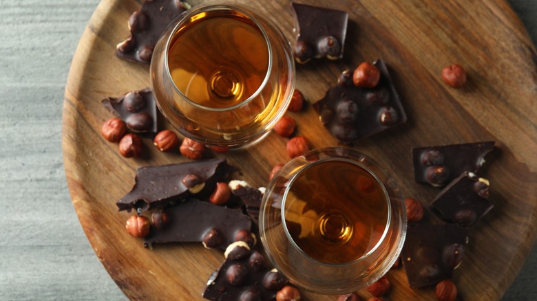 Overview of two Cognac glasses with chocolate and nuts