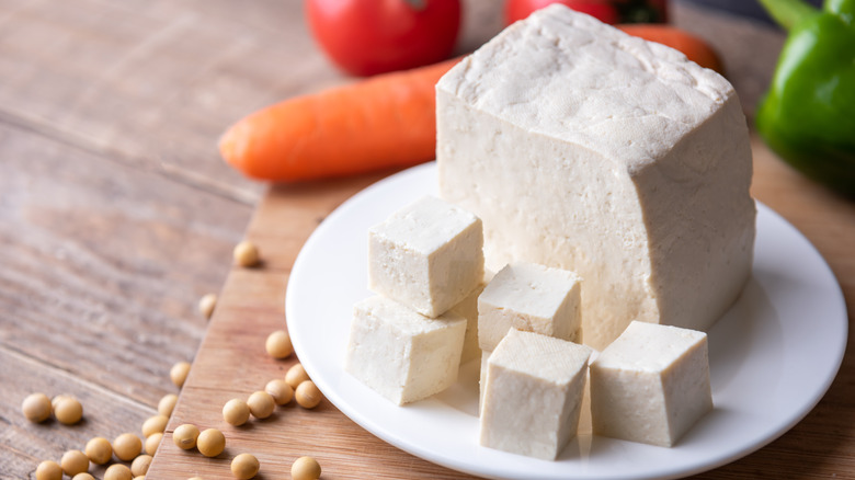 Slab of tofu, half diced into cubes