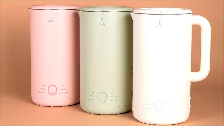 Three Nutr Oasis machines in pink, green, and white