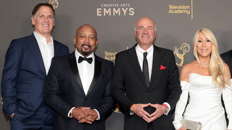 Shark Tank cast consisting of Mark Cuban, Daymond John, Kevin O'Leary, and Lori Greiner smile on the Emmy's red carpet