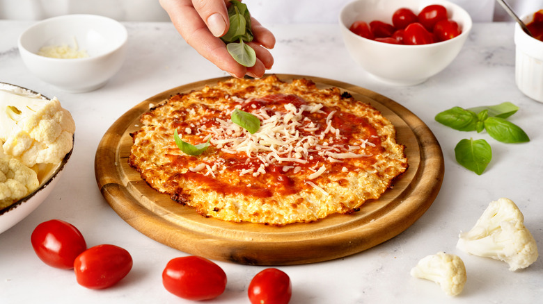 Pizza with cold cheese and basil