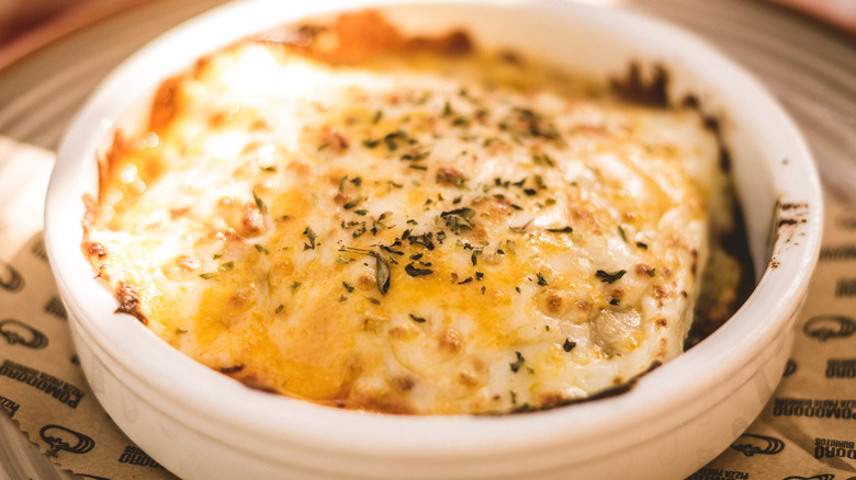 White veal lasagna in clay pot